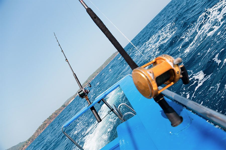 two fishing rods connected to a ship